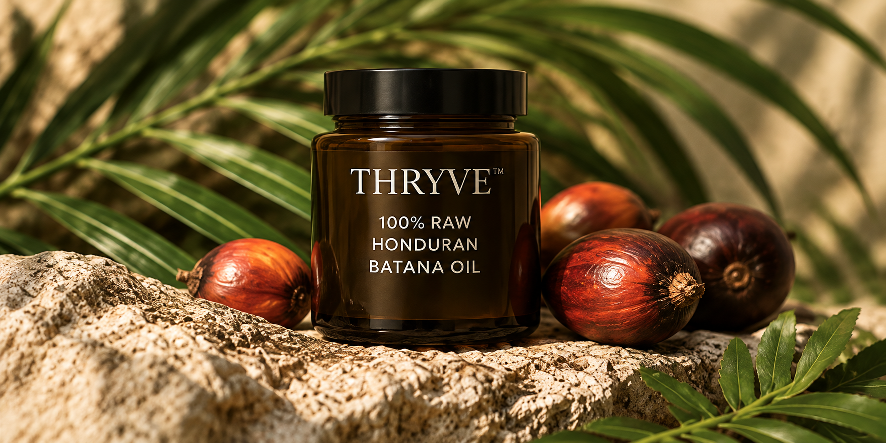 THRYVE Batana Oil jar styled with tropical palm leaves and nuts